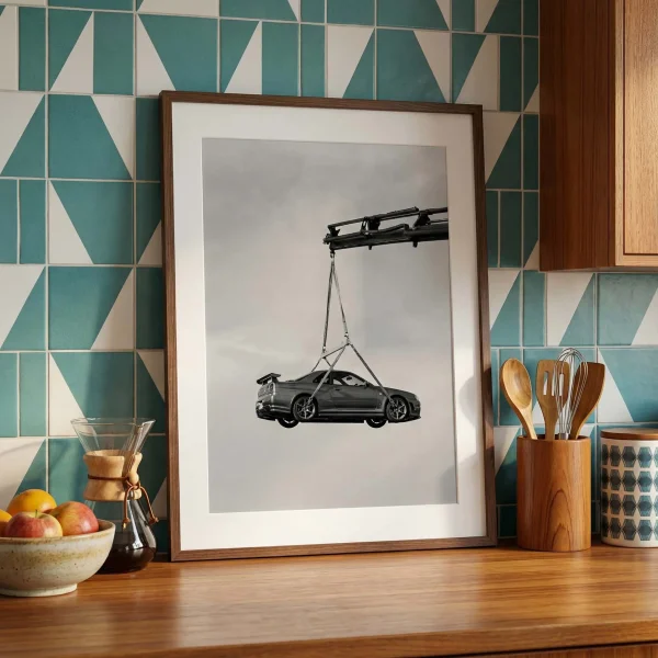 R34 GTR crane lift photography print on a kitchen counter.