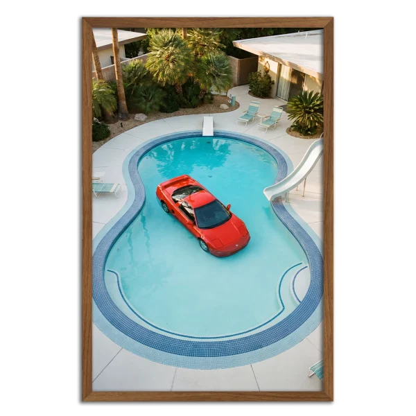 Framed photography print of a red Acura NSX floating in a backyard pool.