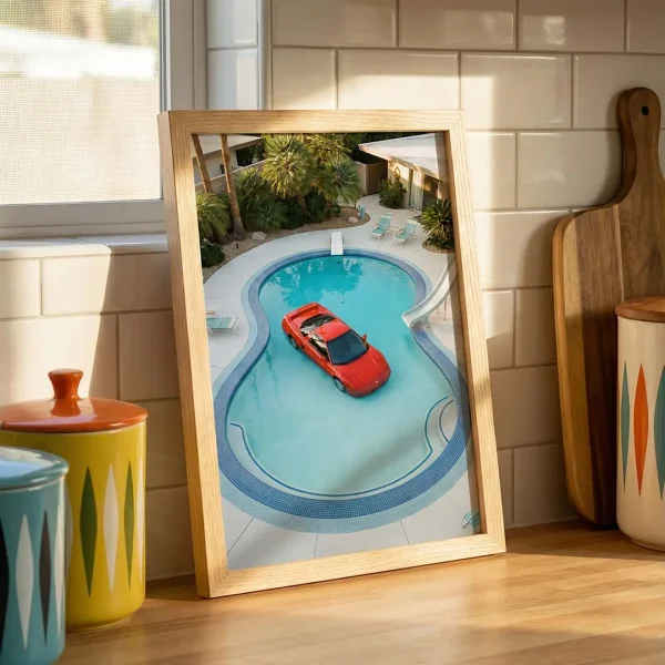 Red Acura NSX pool photography print on a kitchen counter.