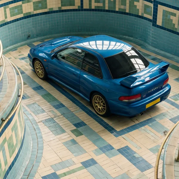 Zoomed-in print of a blue Subaru 22B in an empty mosaic pool.